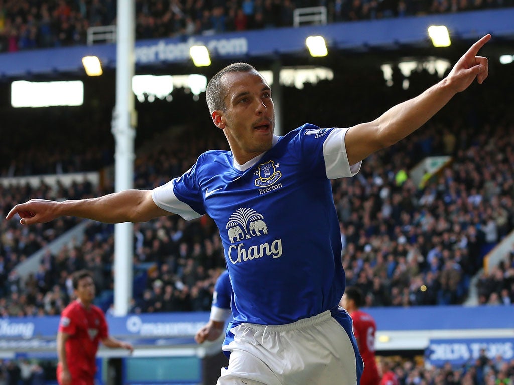 Leon Osman of Everton celebrates after scoring his goal