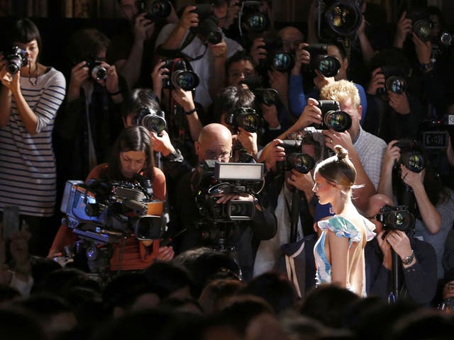 A model striding down the catwalk, sporting a brand new creation by Japanese designer Tsumori Chisato