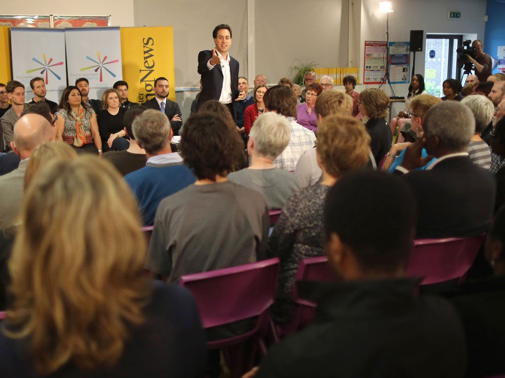 Under question: Ed Miliband with the party faithful in a Manchester school