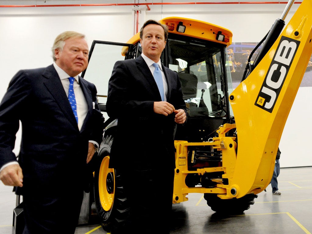 Sir Anthony Bamford, left, owner of JCB, invited David Cameron, right, to open the company's new factory in Sao Paulo, Brazil, last week