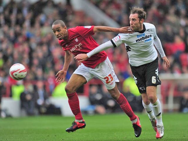 Forest’s Dexter Blackstock (left) and Derby’s Richard Keogh compete for the ball yesterday