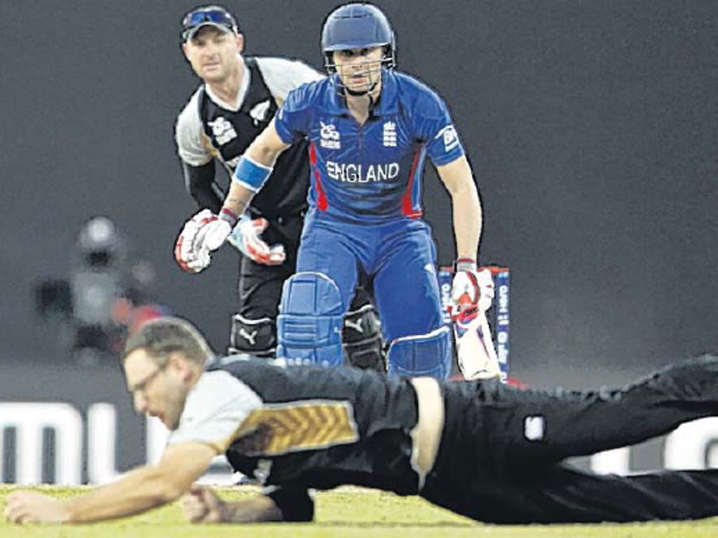 Eoin Morgan watches New Zealand’s Daniel Vettori dive for the ball
during England’s six-wicket victory on Saturday