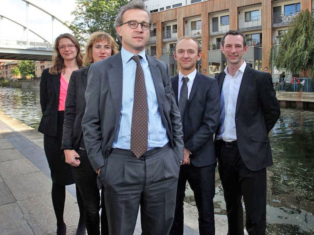 Andreas Wesemann with members of staff – before the photoshoot was interrupted by hecklers