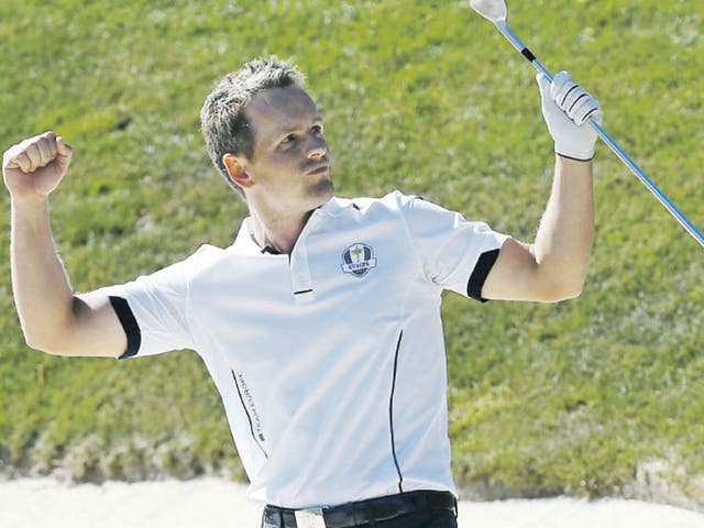 Luke Donald reacts after hitting out of a bunker on the 17th