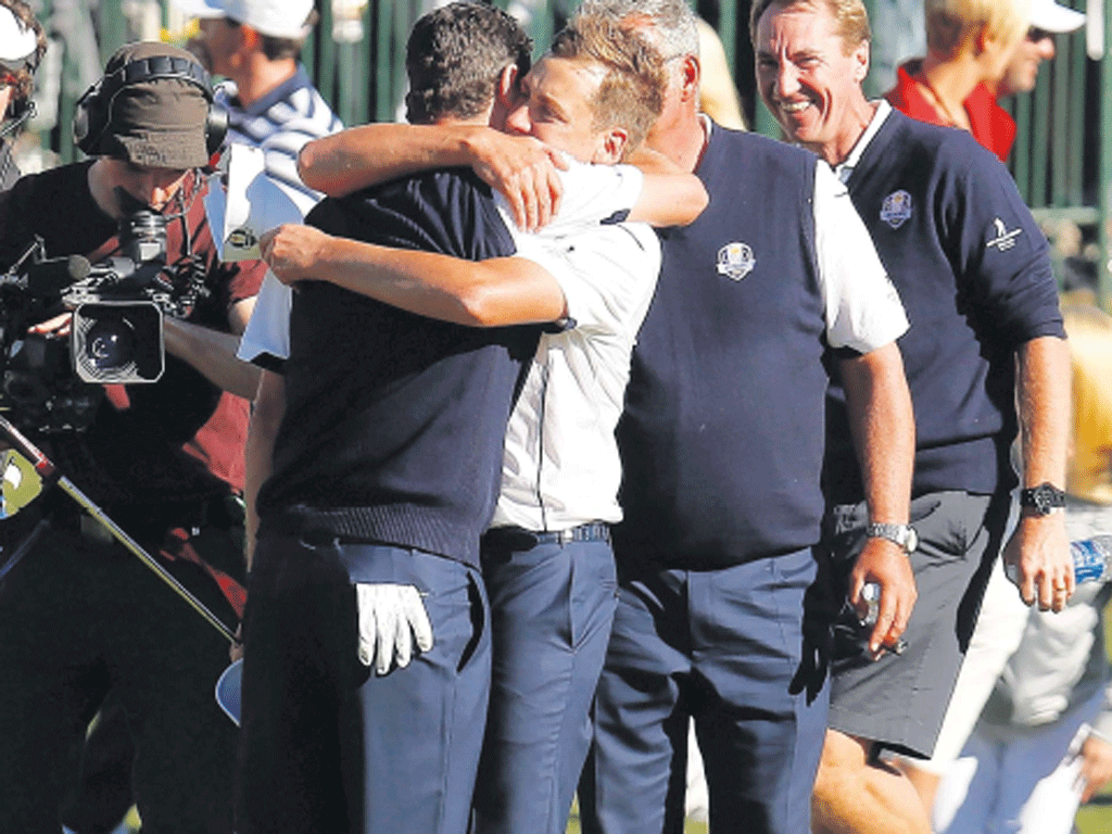 The European players celebrate on their way to winning the Ryder
Cup yesterday