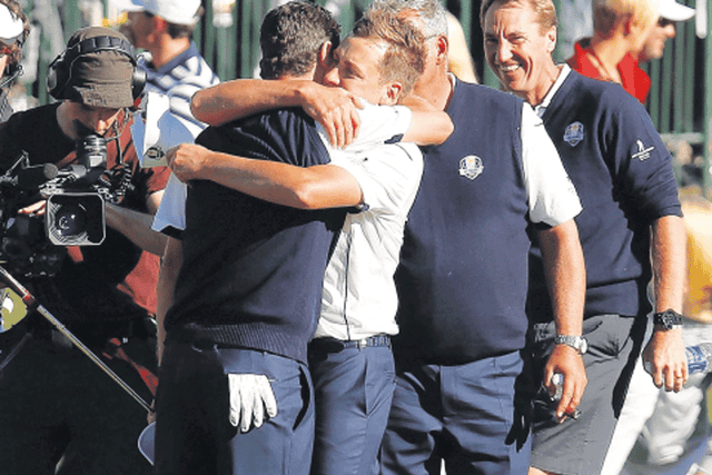 The European players celebrate on their way to winning the Ryder
Cup yesterday