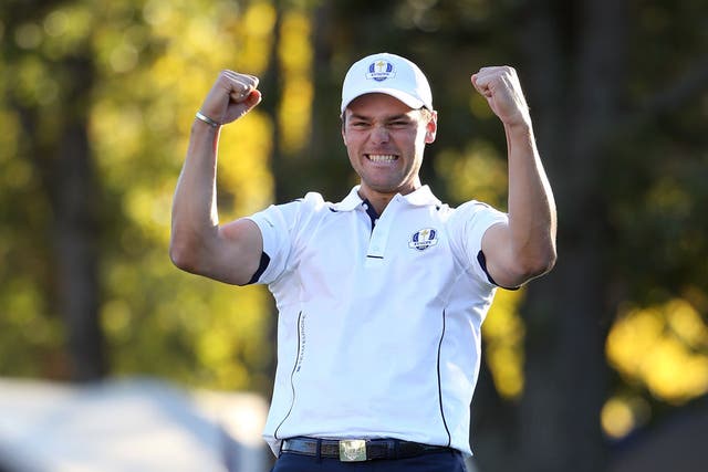Martin Kaymer of Europe celebrates after holing the decisive putt on the 18th green