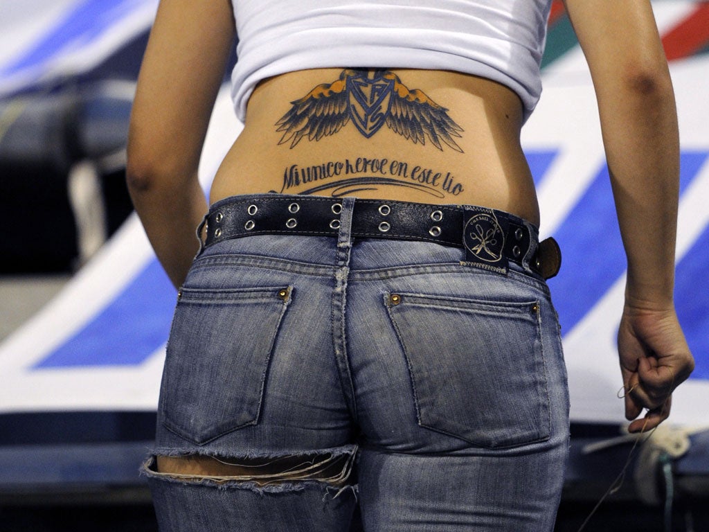A female supporter of Argentina's Velez Sarsfield displays a tattoo at Jose Amalfitani stadium in Buenos Aires, Argentina, on February 15, 2011.