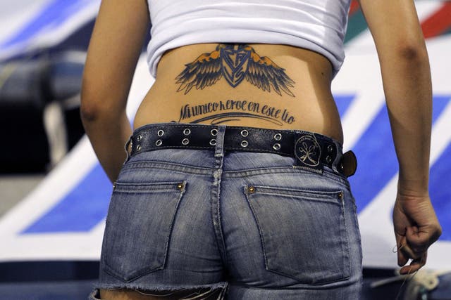A female supporter of Argentina's Velez Sarsfield displays a tattoo at Jose Amalfitani stadium in Buenos Aires, Argentina, on February 15, 2011.
