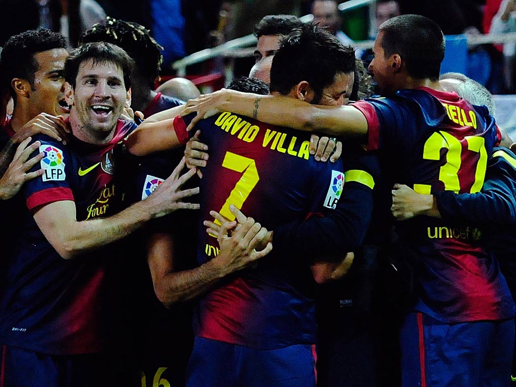 Lionel Messi celebrates with his team-mates