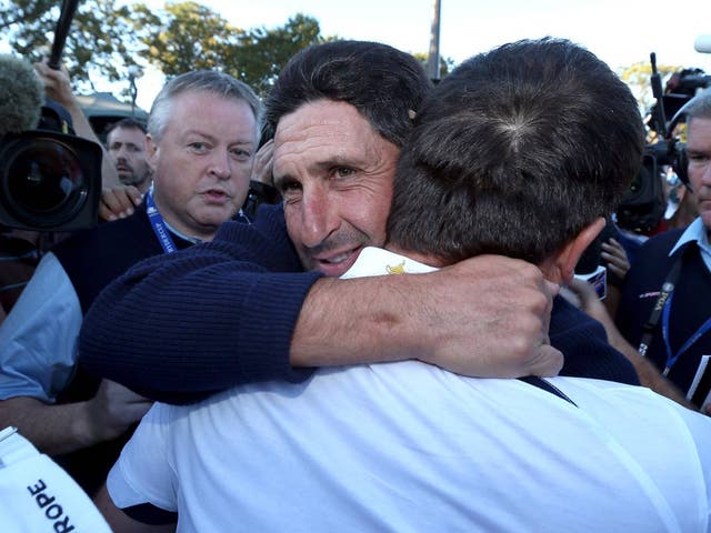 Team captain Jose Maria Olazabal hugs Francesco Molinari after Europe defeated the USA 14.5 to 13.5