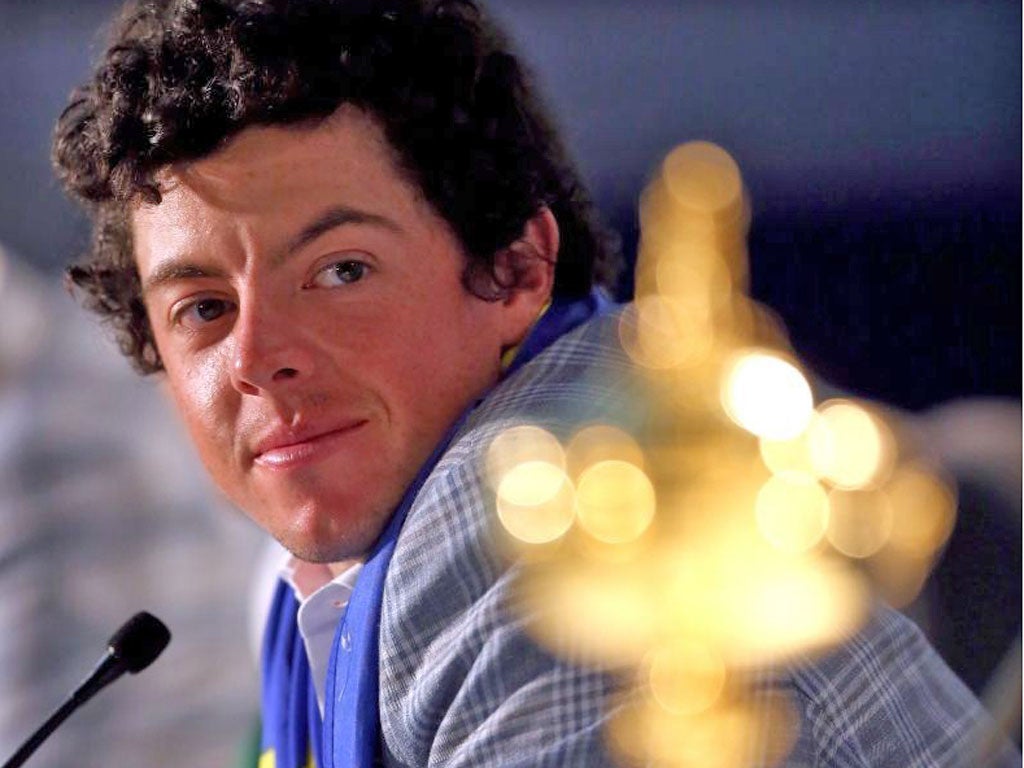 Rory McIlroy admires the Ryder Cup that could so easily have got away