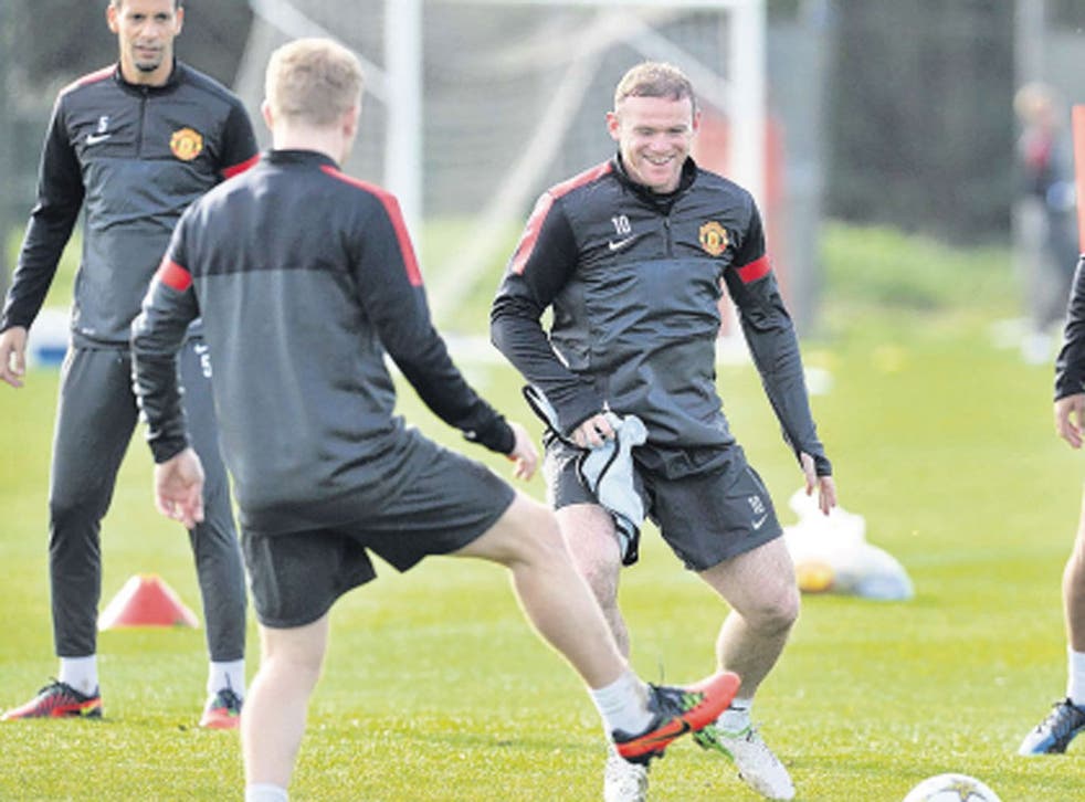 Wayne Rooney (centre) is joined by Mikaël Silvestre (right), who is training with his former team-mates until he finds a new club
