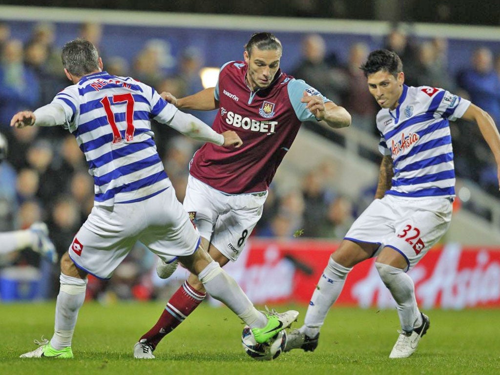 West Ham United's Andy Carroll (on loan from Liverpool) vies with Queens Park Rangers' Ryan Nelsen