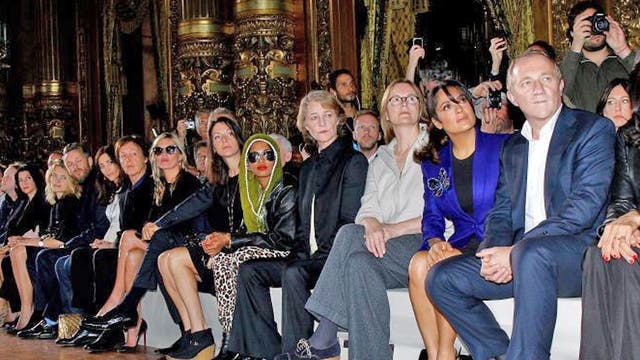 Front row of celebrities (from left): Nancy Shevell; Sir Paul McCartney; Kate Moss; Mario Testino; the rapper M.I.A; the
actress Charlotte Ramplin; the actress Salma Hayek; François-Henri Pinault, the chief executive of luxury goods firm PPR