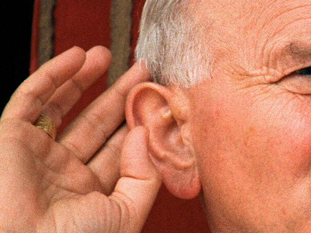 Pope John Paul II is seen in this file picture taken 07 April 1987 in Viedmo, cups his ear during his visit to Argentina.