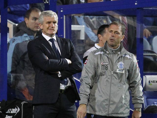 QPR manager Mark Hughes looks on during his side's defeat to West Ham