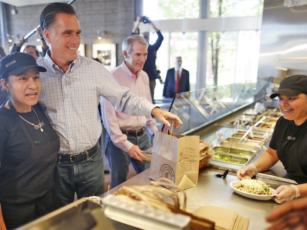 Mitt Romney places his order at a Chipotle restaurant in Denver