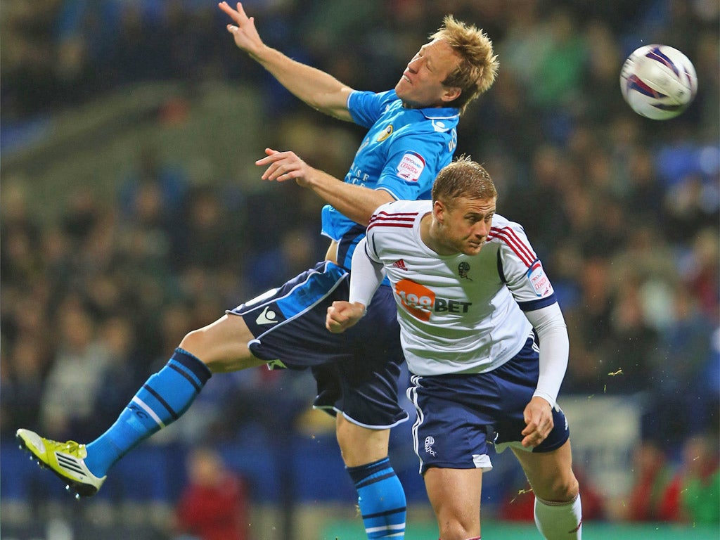 Bolton's Matt Mills (right) tussles with Luciano Becchio of Leeds