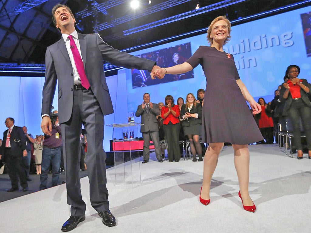 Ed Miliband takes the applause of the conference crowd with his wife Justine