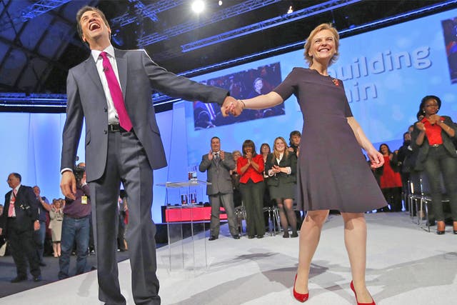 Ed Miliband takes the applause of the conference crowd with his wife Justine