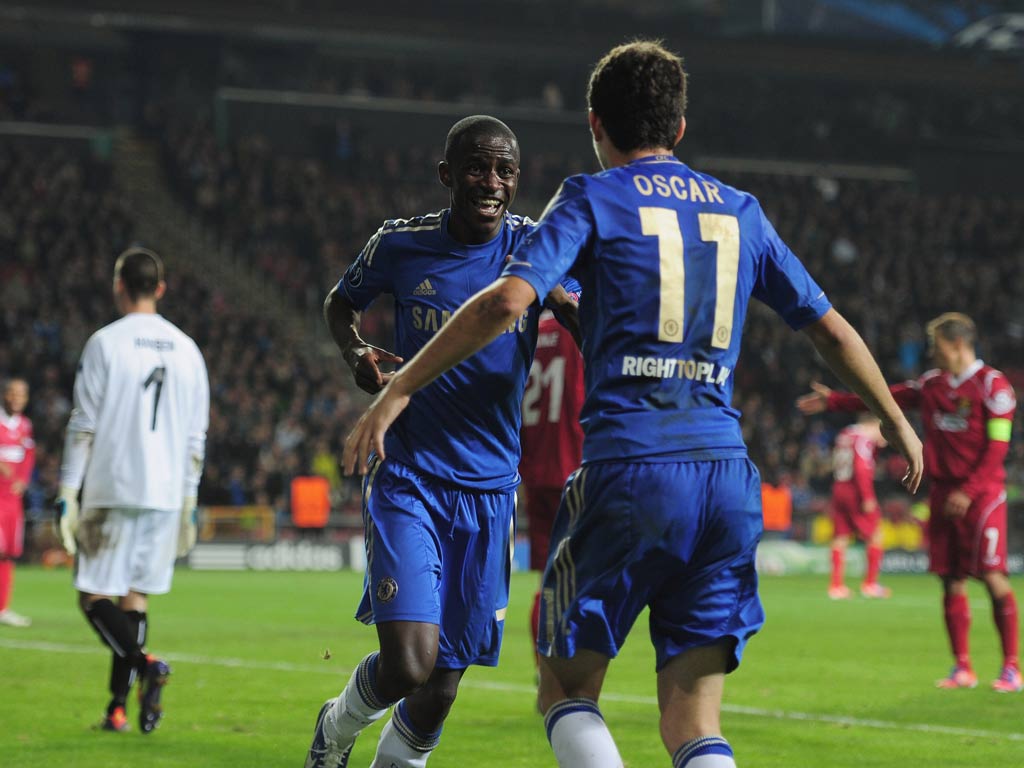 Ramires of Chelsea celebrates with team-mate Oscar after scoring during the UEFA Champions League Group E match against FC Nordsjaelland