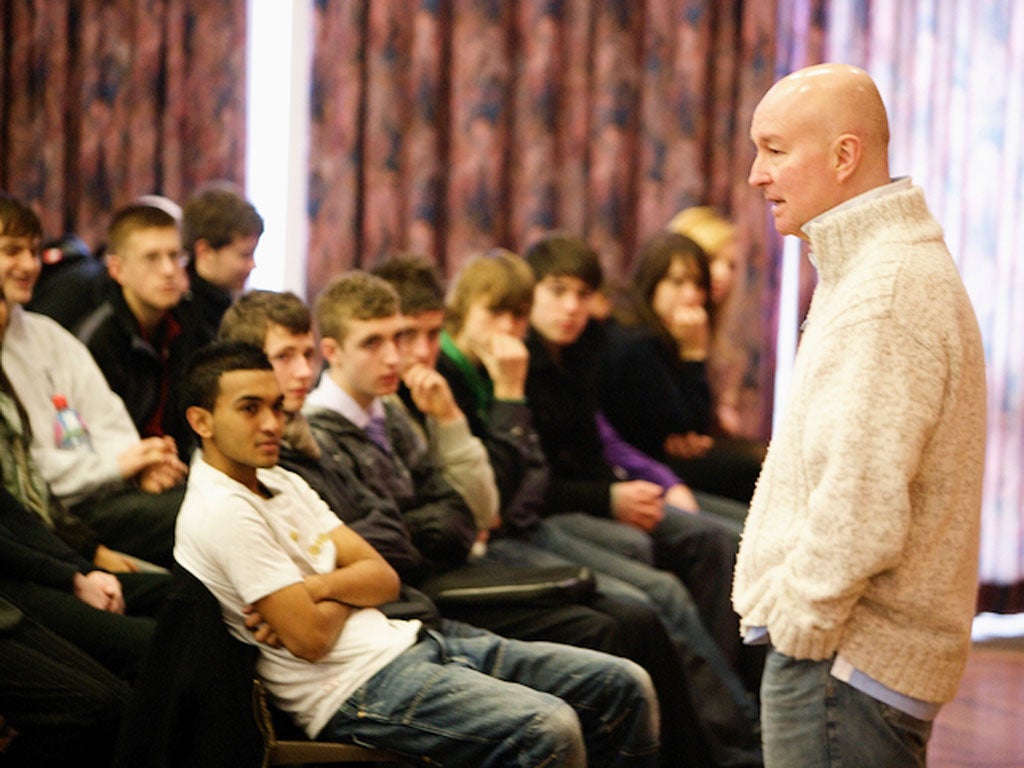 Teenage Cancer Trust Director of Education, Nigel Revel, speaking to some young people in a school talk.