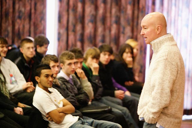 Teenage Cancer Trust Director of Education, Nigel Revel, speaking to some young people in a school talk. 