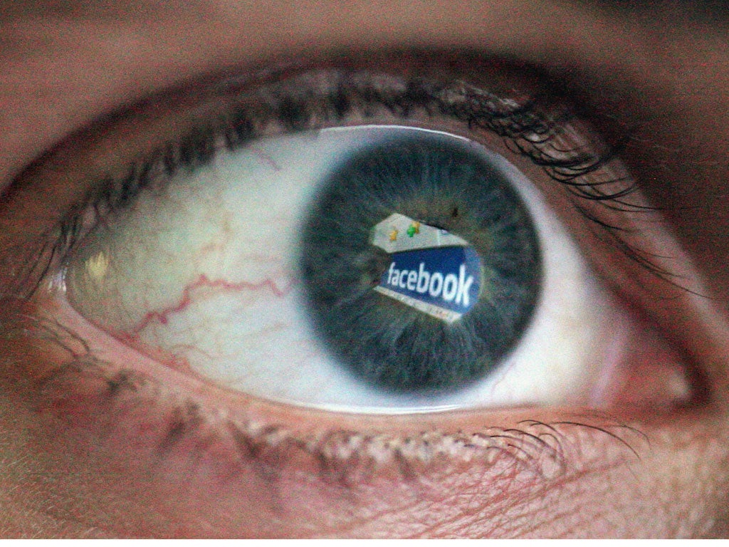 The Social networking site Facebook is reflected in the eye of a man on March 25, 2009 in London, England.
