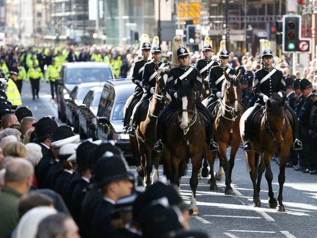 Crowds line the streets to watch the coffin of Greater Manchester Police constable Nicola Hughes