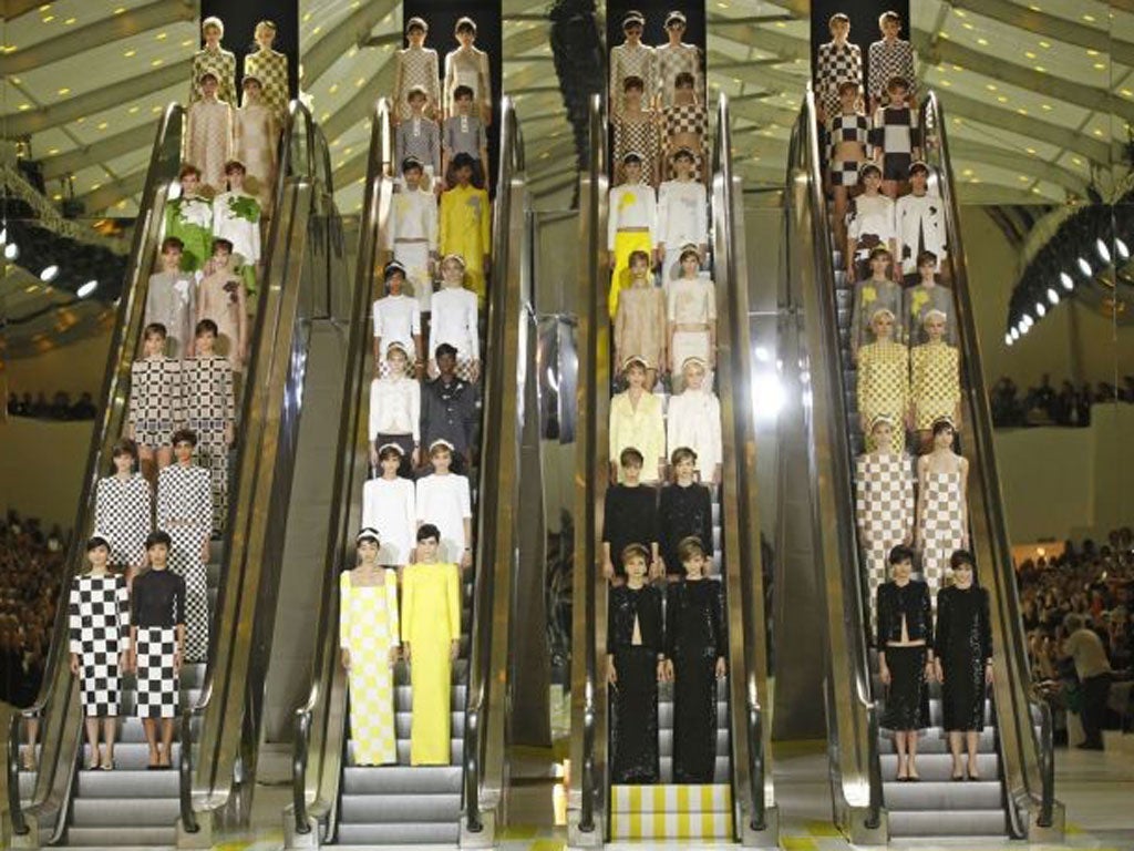Louis Vuitton Spring/Summer 2013 show included a prosaic mode of transport as the models came down to the catwalk via escalators