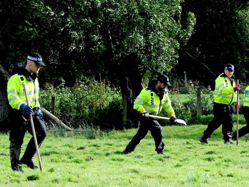 Police and a rescue team search for April