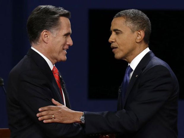 Mitt Romney and Barack Obama shake hands after the first presidential debate at the University of Denver