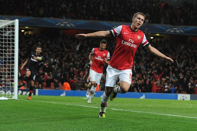 Aaron Ramsey celebrates his Champions League goal against Olympiakos