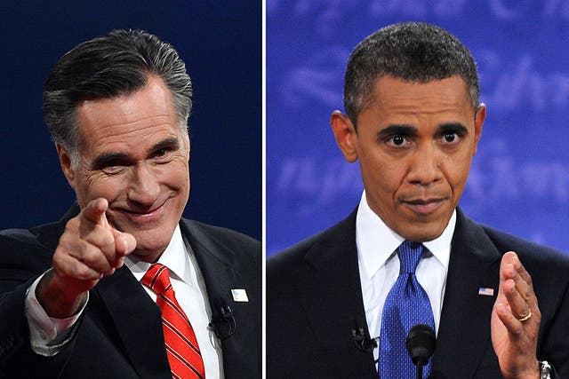 Mitt Romney and Barack Obama at the conclusion of the debate in Denver, Colorado