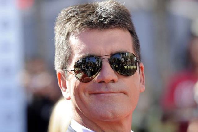 Simon Fuller is plotting to outmanoeuvre his great rival, Simon Cowell (pictured)