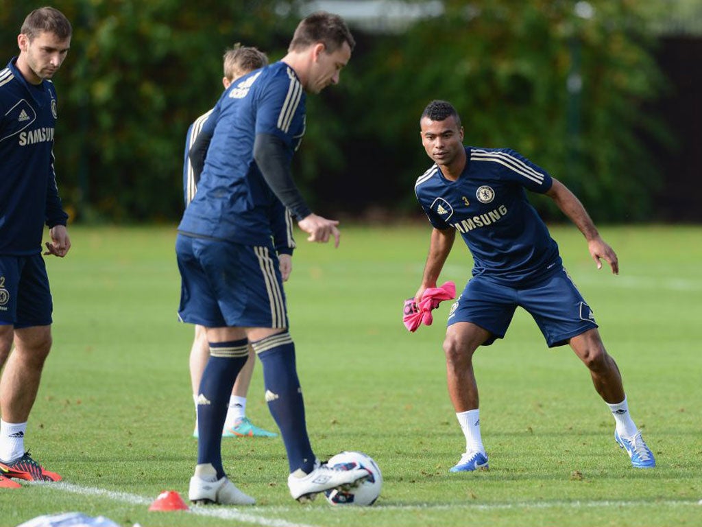 Ashley Cole and John Terry train at Cobham yesterday