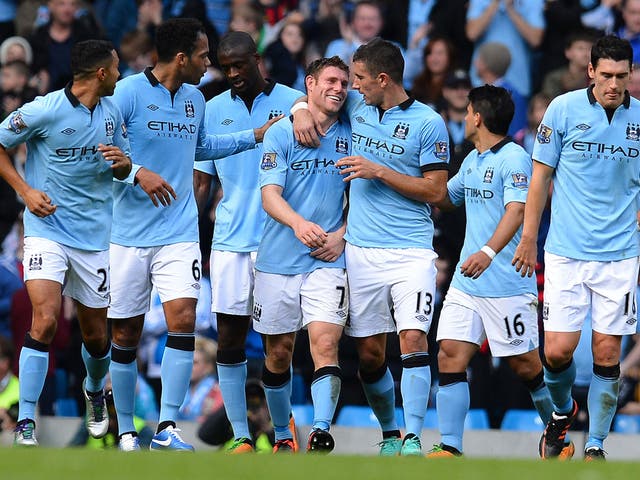 <b>Man City 3-0 Sunderland</b>
James Milner (4th L) celebrates with fellow goal-scorer Serbian defender Aleksandar Kolarov (3rd R) after scoring his side's third goal.