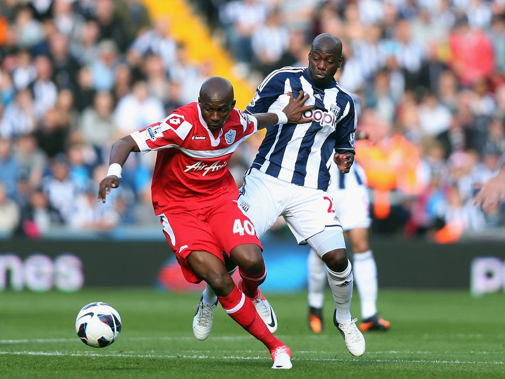 West Brom 3-2 QPR Stephane Mbia of Queen Park Rangers holds off Stephane Mbia