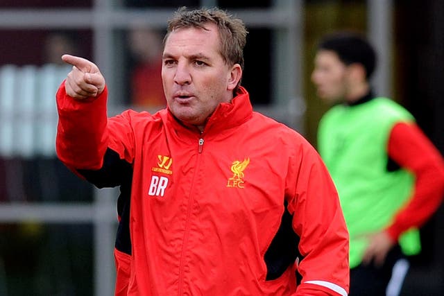 New direction: Brendan Rodgers is teaching his passing game to Liverpool while also waiting for some promising youngsters to come through