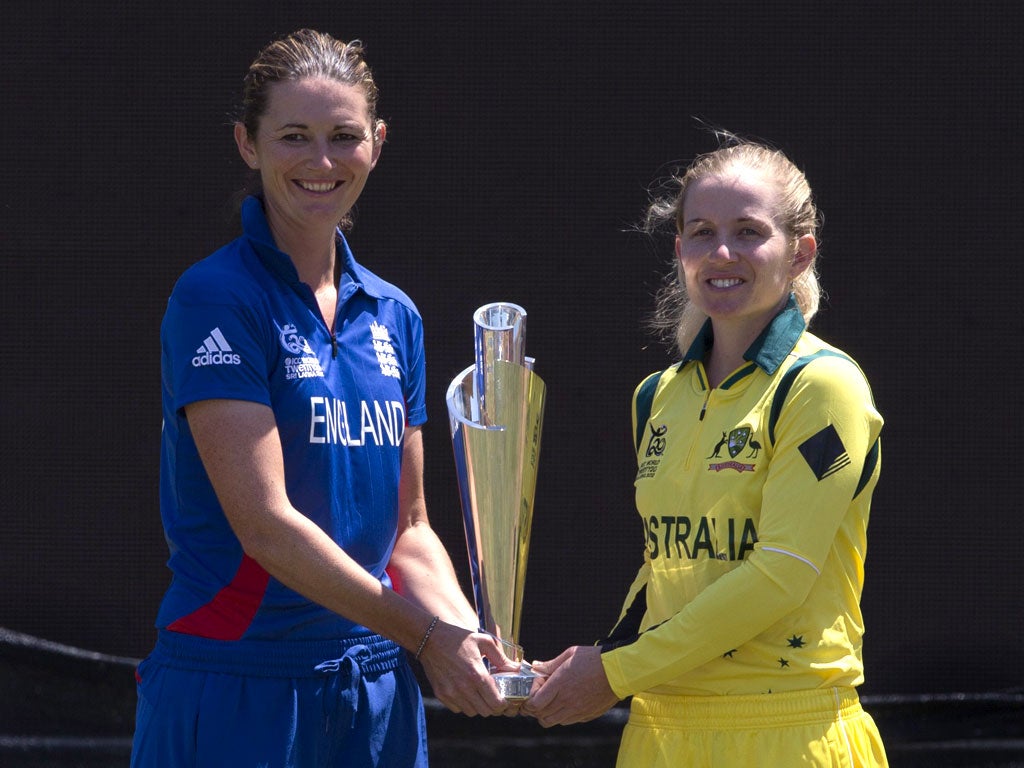 Hands on: Captains Charlotte Edwards and Jodie Fields hold the T20 trophy