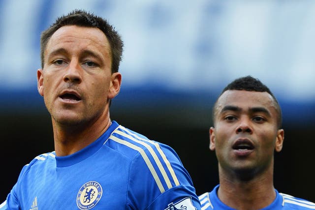 Double trouble: John Terry (left) and Ashley Cole are a study in concentration during yesterday's 4-1 victory over Norwich at Stamford Bridge, but although fans backed them, Cole is to be disciplined