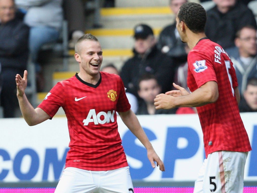 Tom Cleverley of Manchester United celebrates his goal with teammate Rio Ferdinand