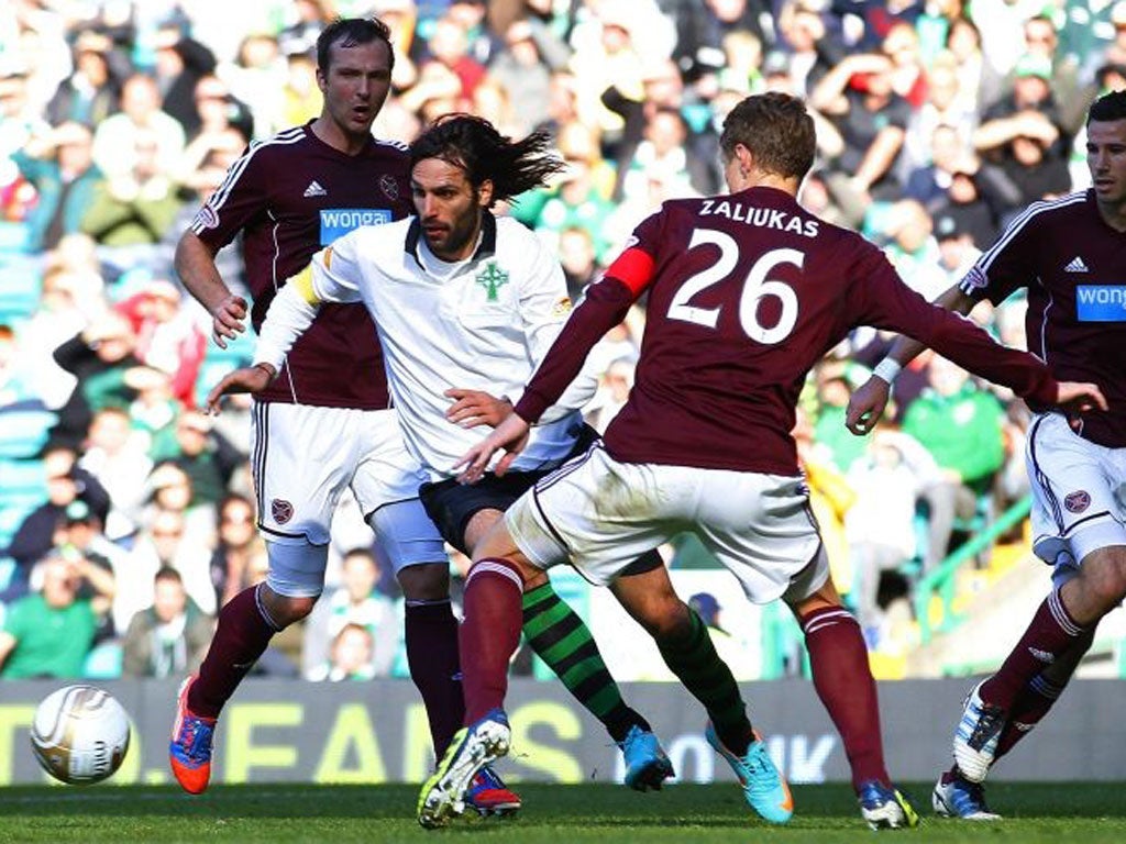 Georgios Samaras runs at the Hearts defence during Celtic’s 1-0
victory