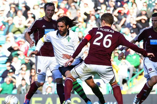 Georgios Samaras runs at the Hearts defence during Celtic’s 1-0
victory