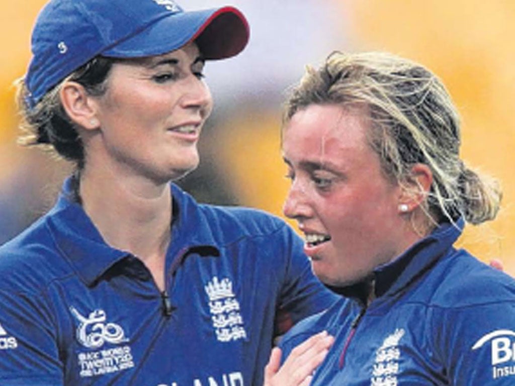 England captain Charlotte Edwards consoles Danielle Hazell after the defeat