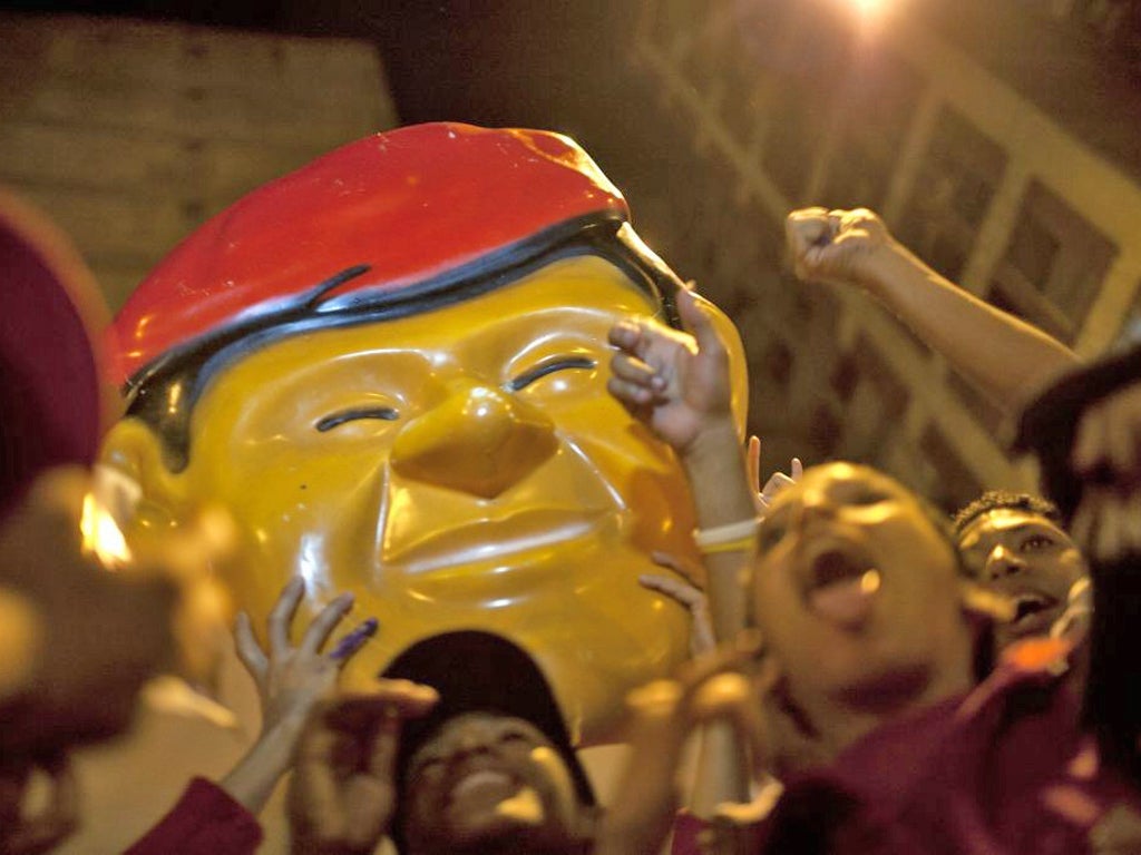 Supporters of Venezuela's President Hugo Chavez celebrate in downtown Caracas