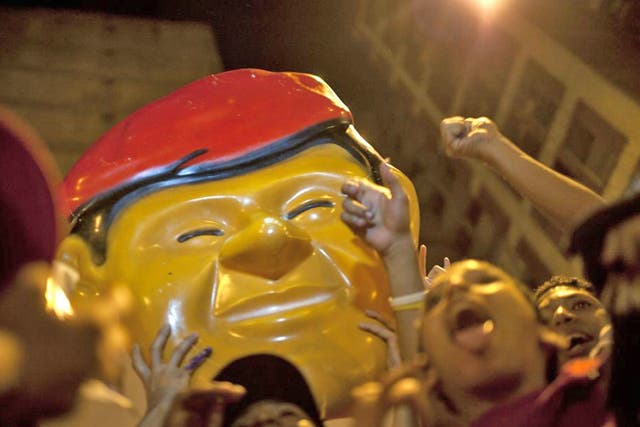 Supporters of Venezuela's President Hugo Chavez celebrate in downtown Caracas