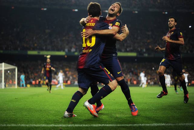 Lionel Messi celebrates after scoring his second against Real Madrid