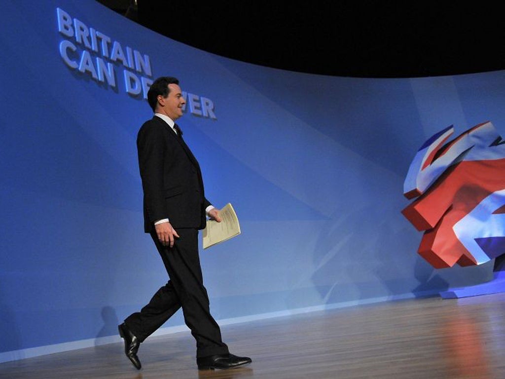George Osborne arrives on stage to deliver his keynote speech at the Conservative Party's annual conference in Birmingham